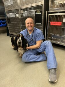 Veterinarian Chad Brown with dog