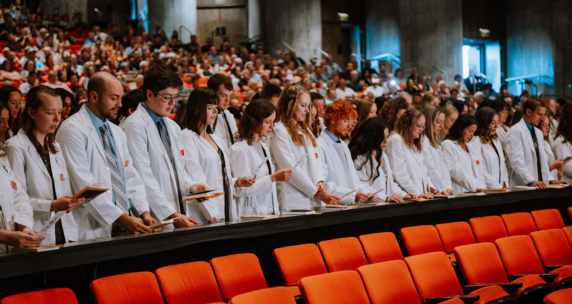 Students reading veterinary oath during White Coat Ceremony