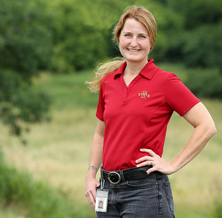 Dr. Suzanne Millman standing in field