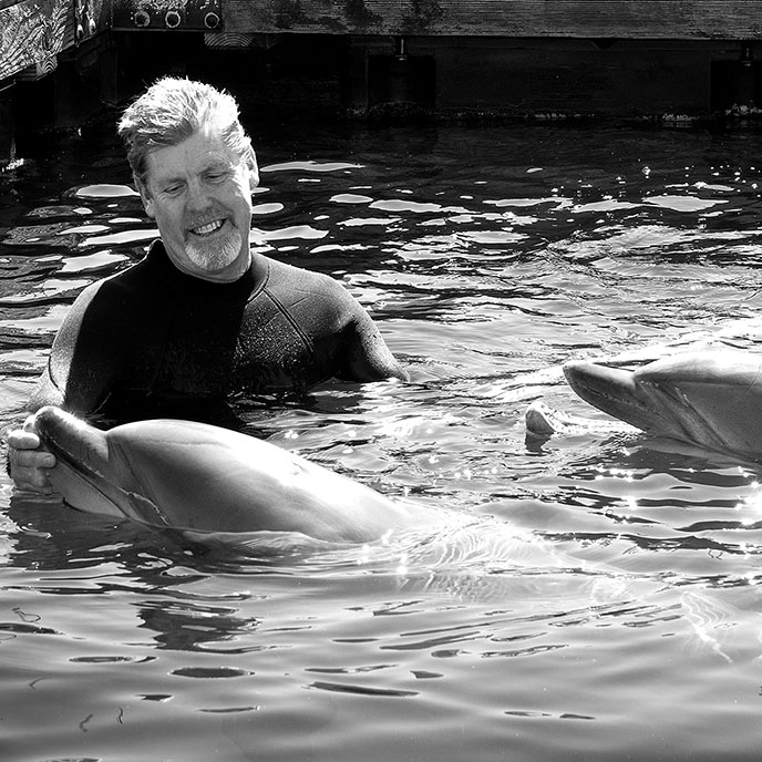 Dr. Eric Jensen with dolphin