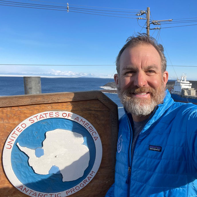 Dr. Shawn Johnson with Antarctica Project sign