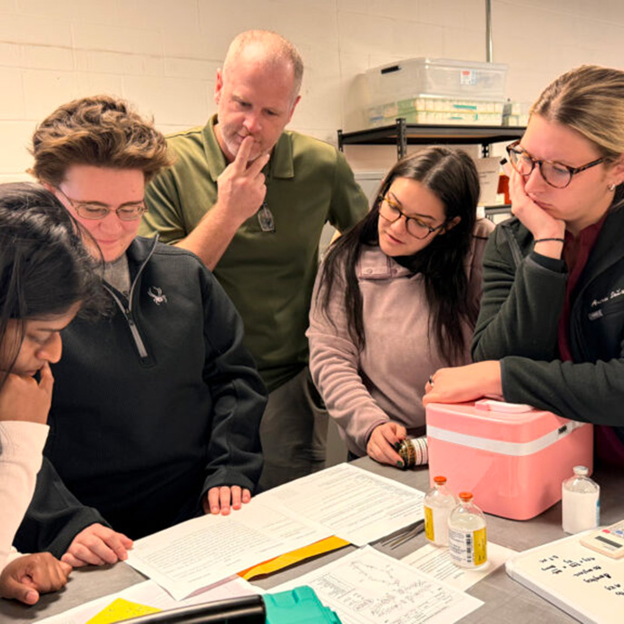 veterinary students reviewing the case clues