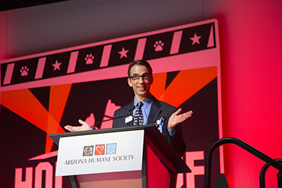 Dr. Steven Hansen, AHS President and CEO presenting at a podium