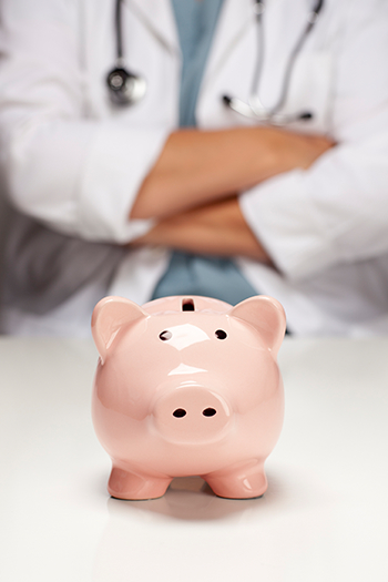 piggy bank with veterinarian in background