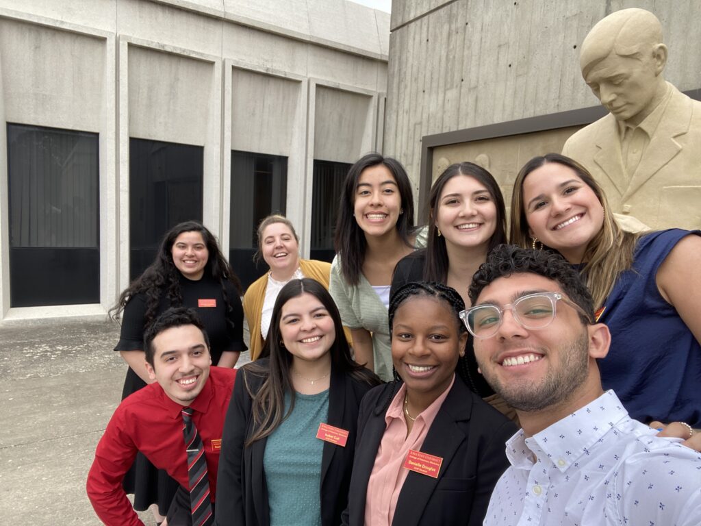 Group of students in front of Gentle Doctor Statue and Patterson Hall at the College of Veterinary Medicine